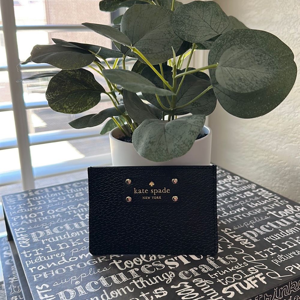 Kate Spade card holder in black leather.